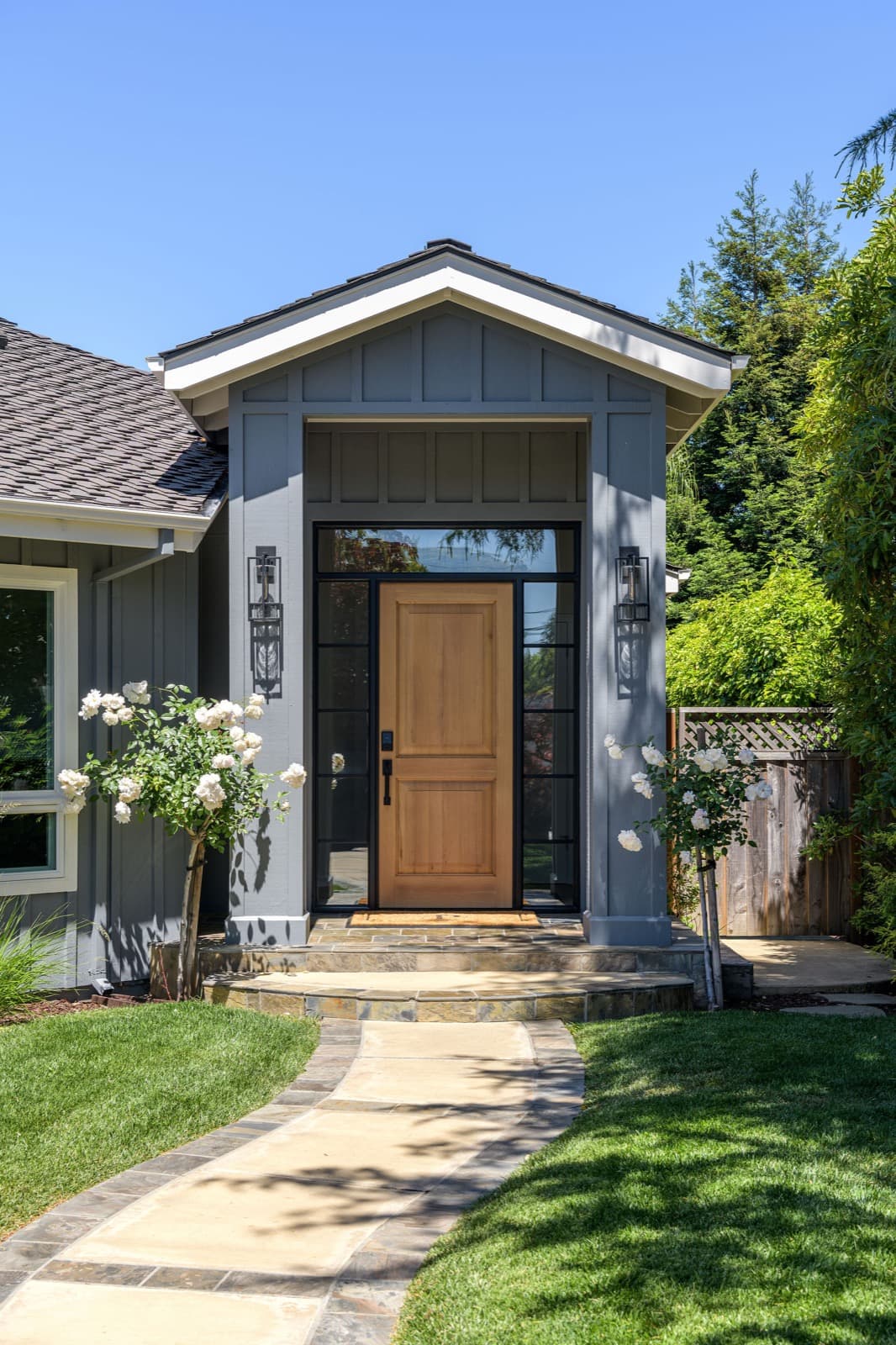 Modern kitchen remodel by Barcci Builders — light wood cabinetry with marble backsplash